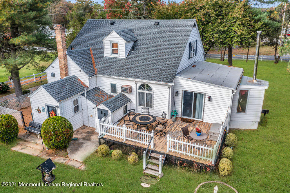 195 Bennett Road Freehold, NJ 07728 - Photo 72 of 90 a aerial view of a house with a yard patio and fire pit