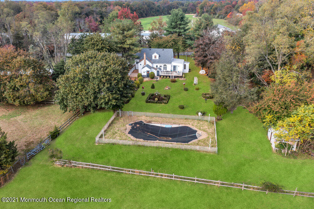 195 Bennett Road Freehold, NJ 07728 - Photo 73 of 90 a view of a back yard of a house with a yard