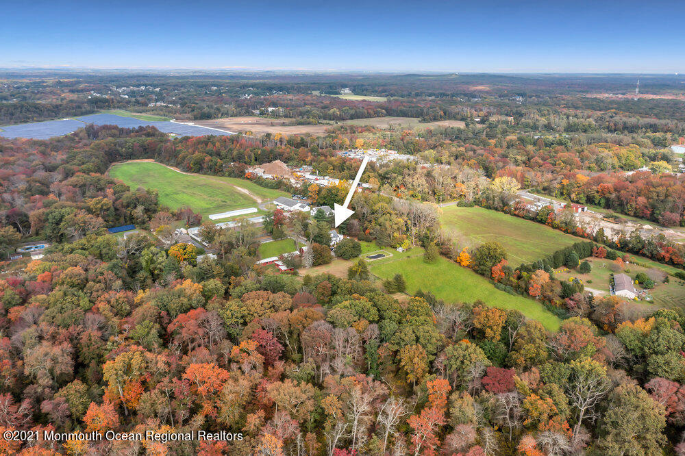 195 Bennett Road Freehold, NJ 07728 - Photo 83 of 90 an aerial view of residential building with outdoor space and lake view