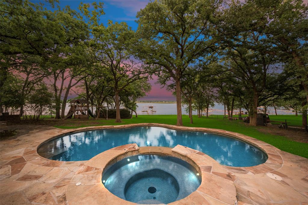 a view of swimming pool with a yard
