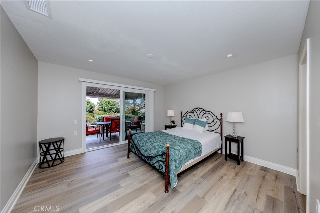 3379 Punta Alta, Unit B Laguna Woods, CA 92637 - Photo 12 of 25 a bedroom with a bed window and a table