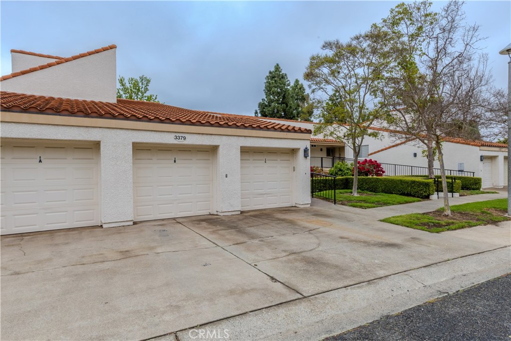 3379 Punta Alta, Unit B Laguna Woods, CA 92637 - Photo 24 of 25 a view of backyard of house and garage