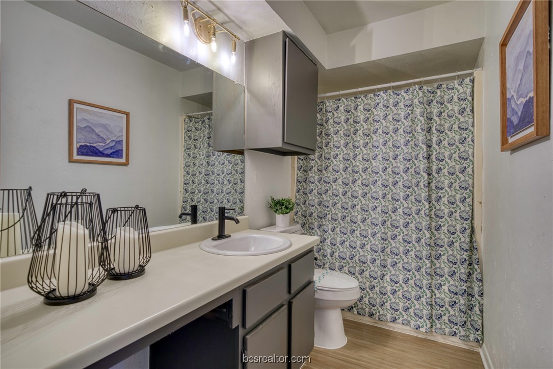 2807 Sprucewood Street, Unit A Bryan, TX 77801 - Photo 10 of 13 Bathroom featuring wood finished floors and vanity