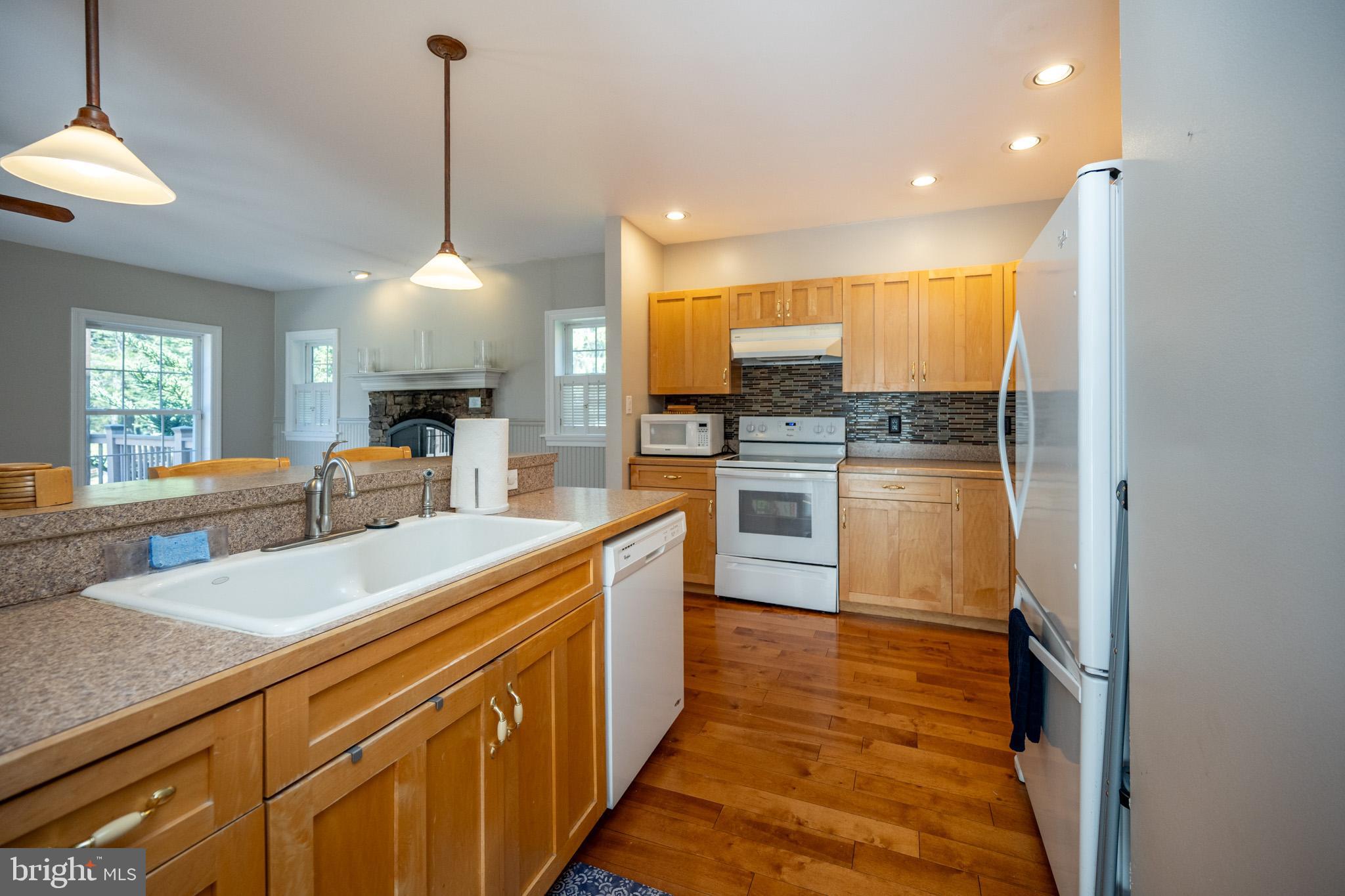 32 Hazelhurst Lane Swanton, MD 21561 - Photo 23 of 73 a kitchen with stainless steel appliances granite countertop a sink and a refrigerator