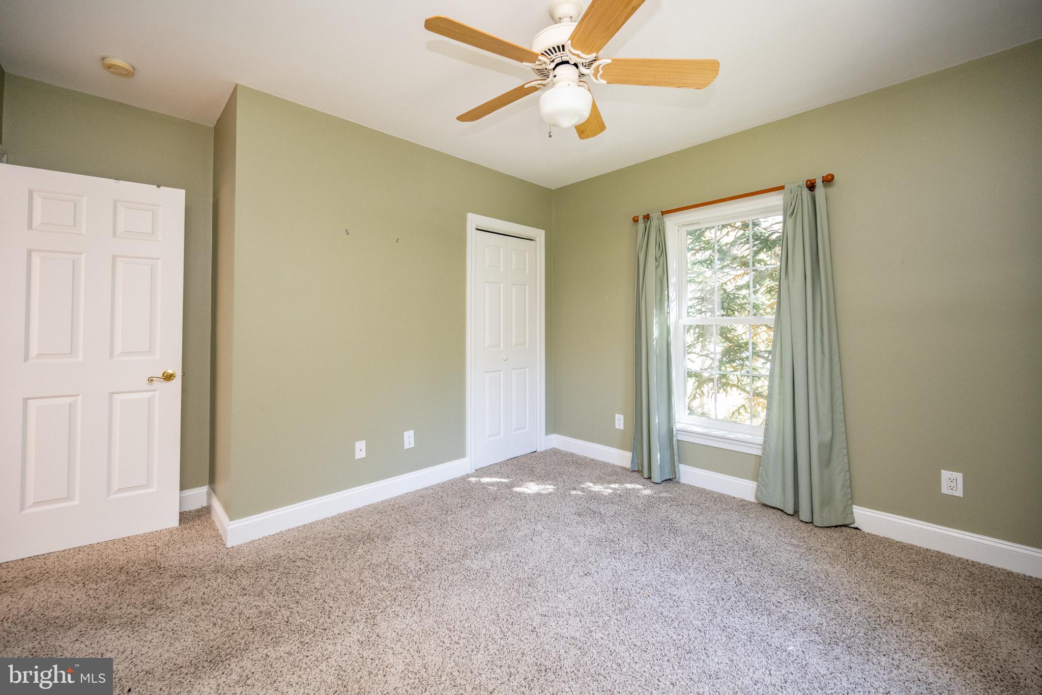 32 Hazelhurst Lane Swanton, MD 21561 - Photo 26 of 73 an empty room with windows and fan
