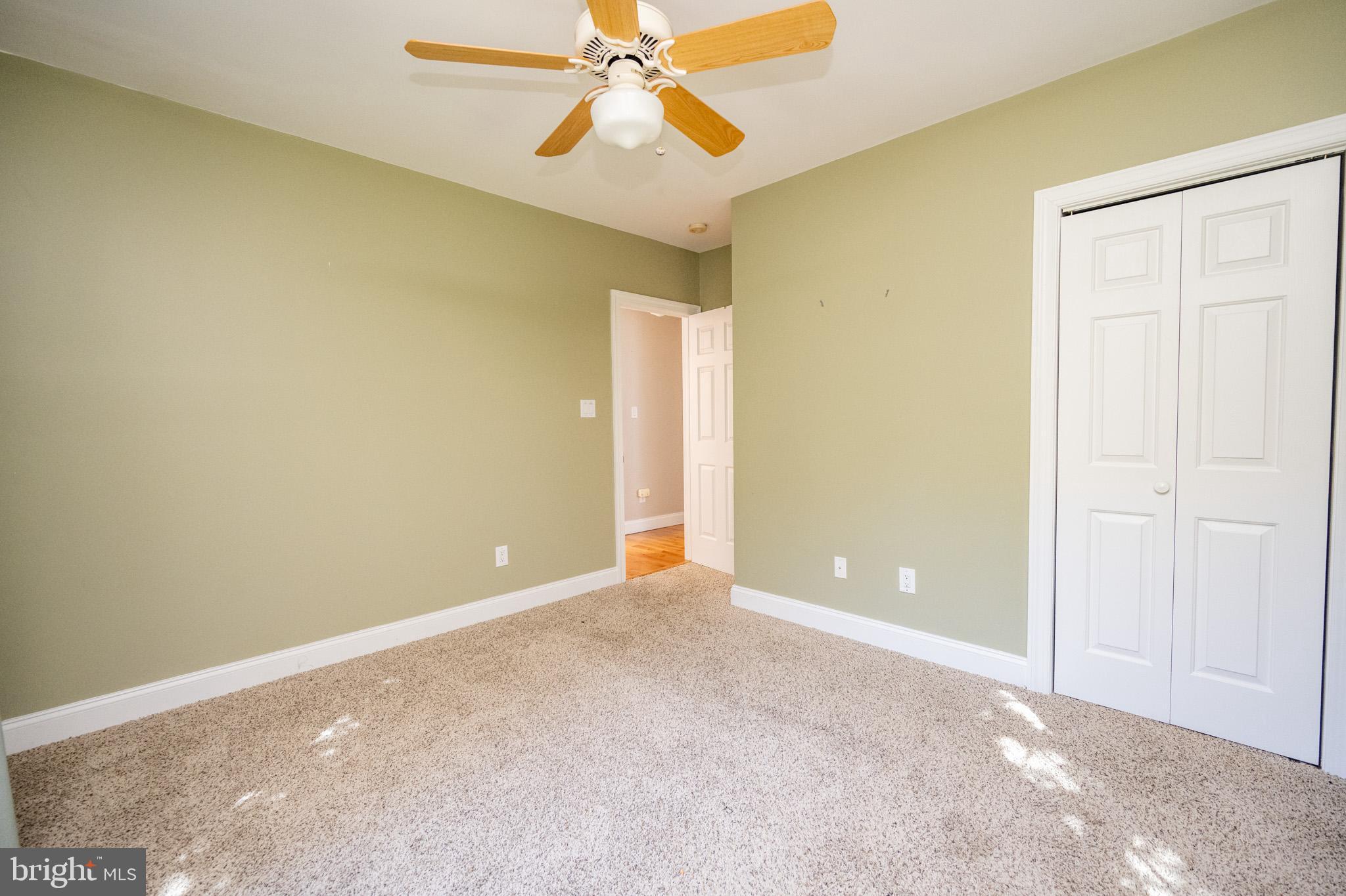 32 Hazelhurst Lane Swanton, MD 21561 - Photo 27 of 73 an empty room with a ceiling fan and a window