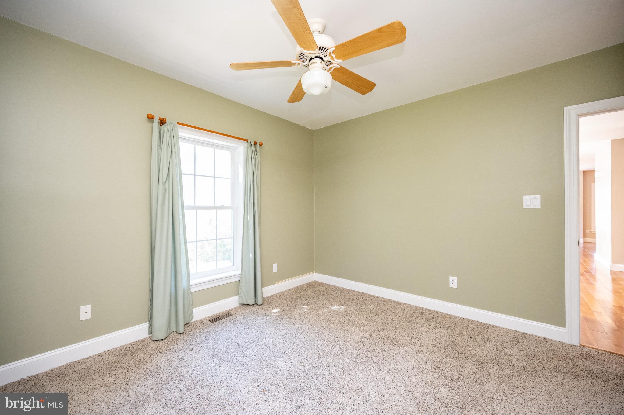 32 Hazelhurst Lane Swanton, MD 21561 - Photo 28 of 73 an empty room with closet and a ceiling fan