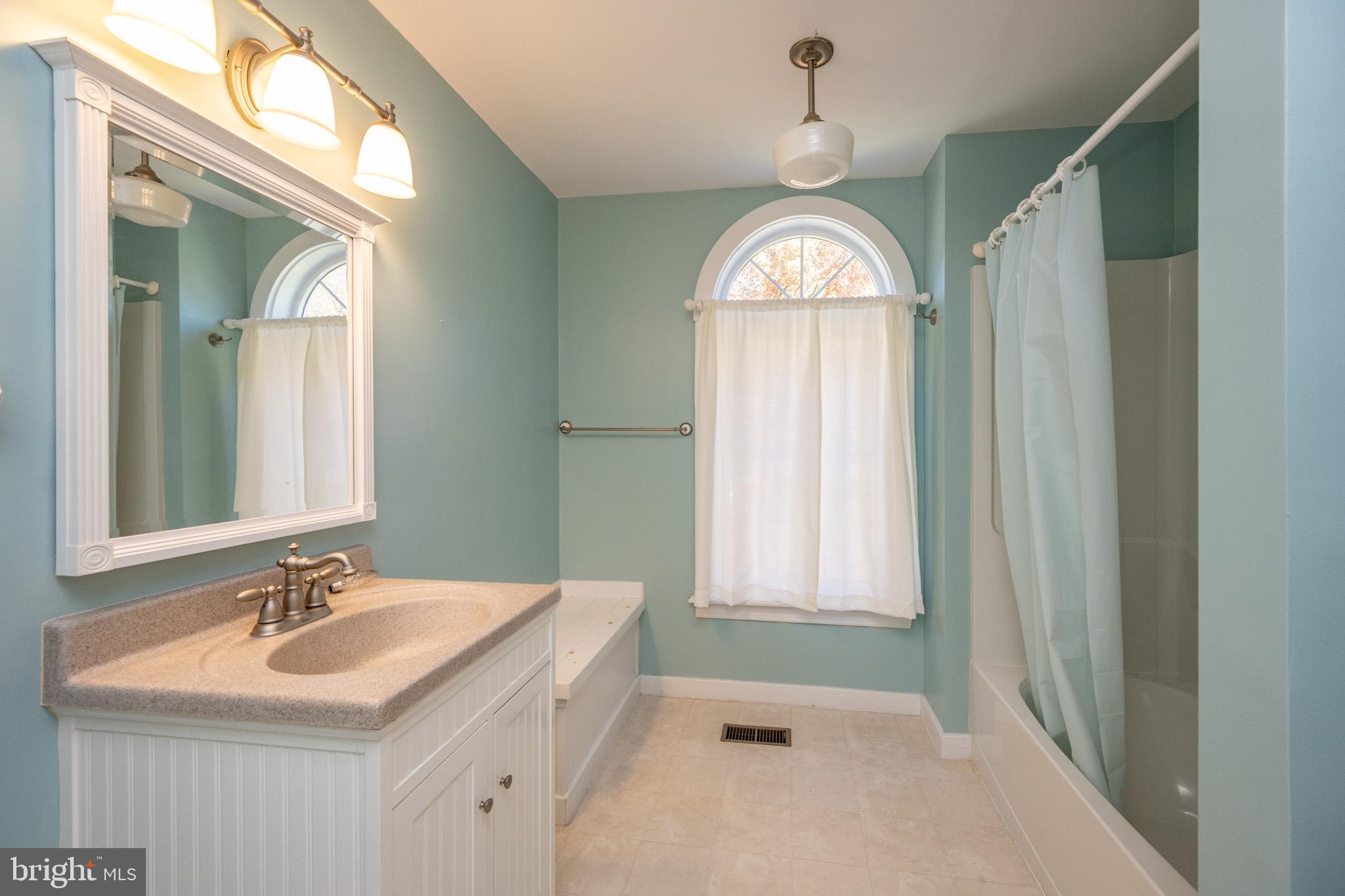 32 Hazelhurst Lane Swanton, MD 21561 - Photo 34 of 73 a view of a bathroom with dual sinks
