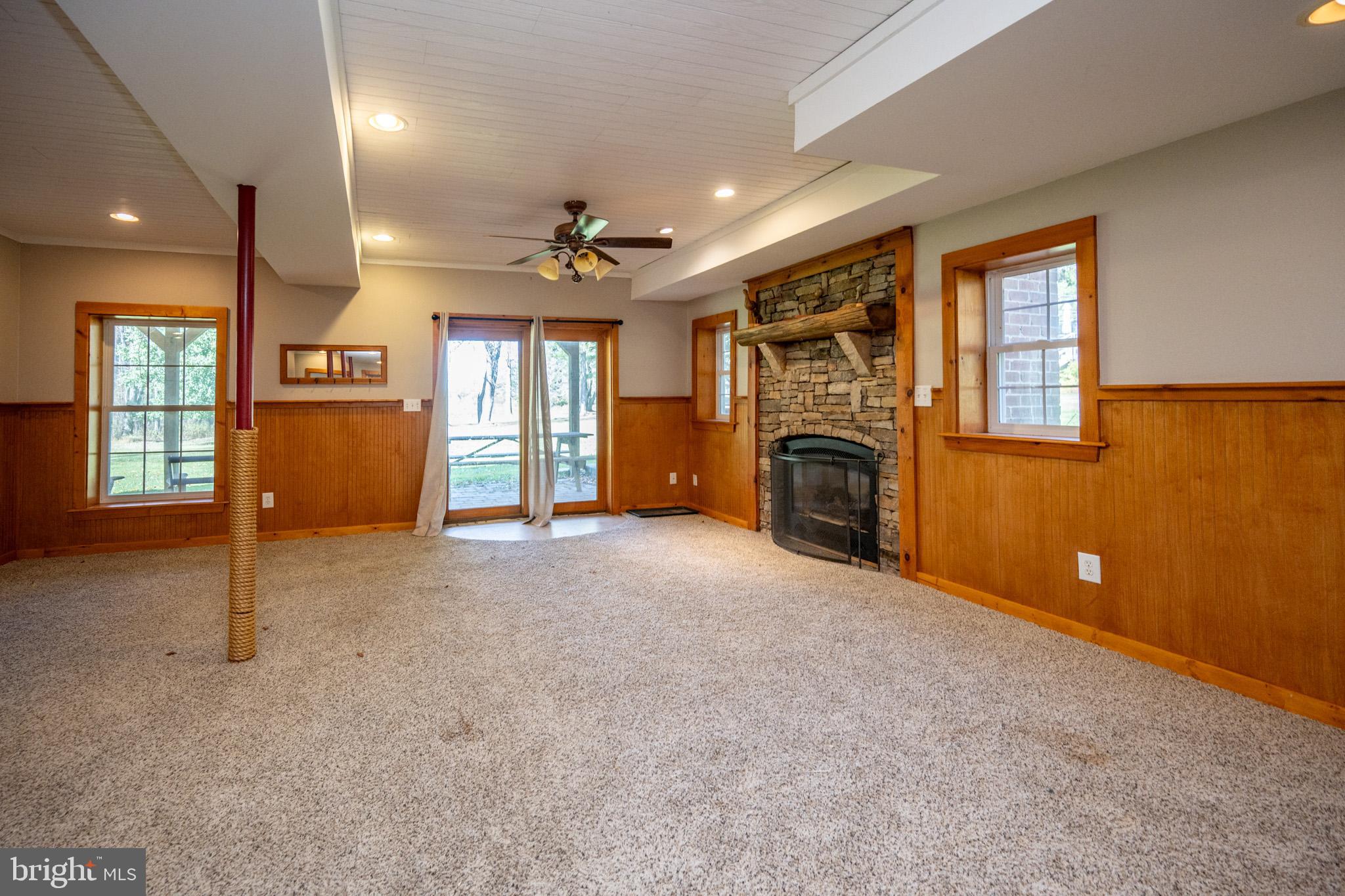 32 Hazelhurst Lane Swanton, MD 21561 - Photo 51 of 73 a view of a livingroom with furniture fireplace and windows