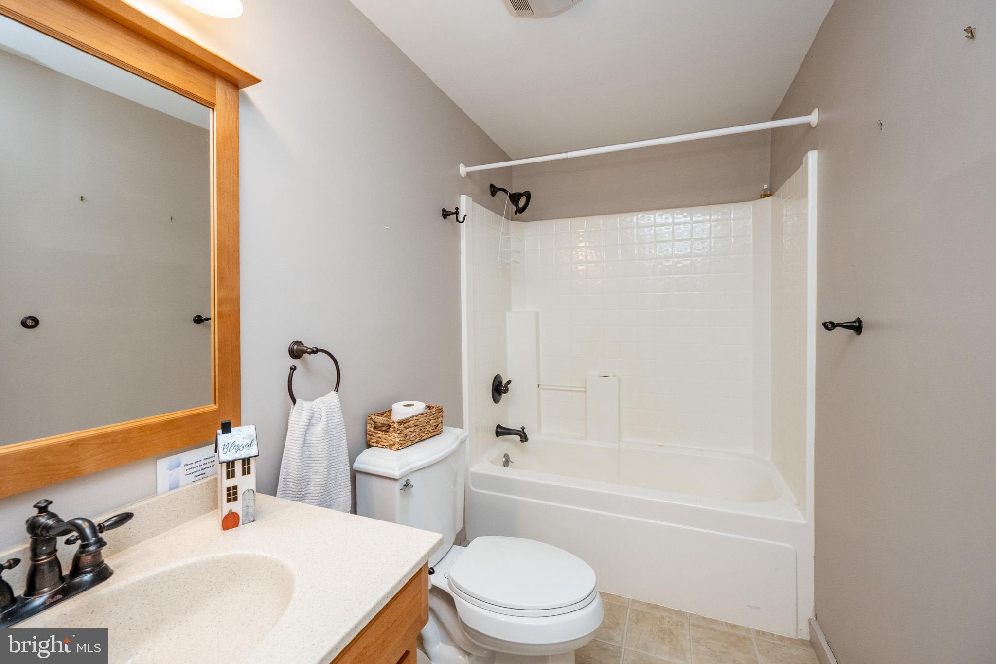 32 Hazelhurst Lane Swanton, MD 21561 - Photo 56 of 73 a bathroom with a sink toilet and shower