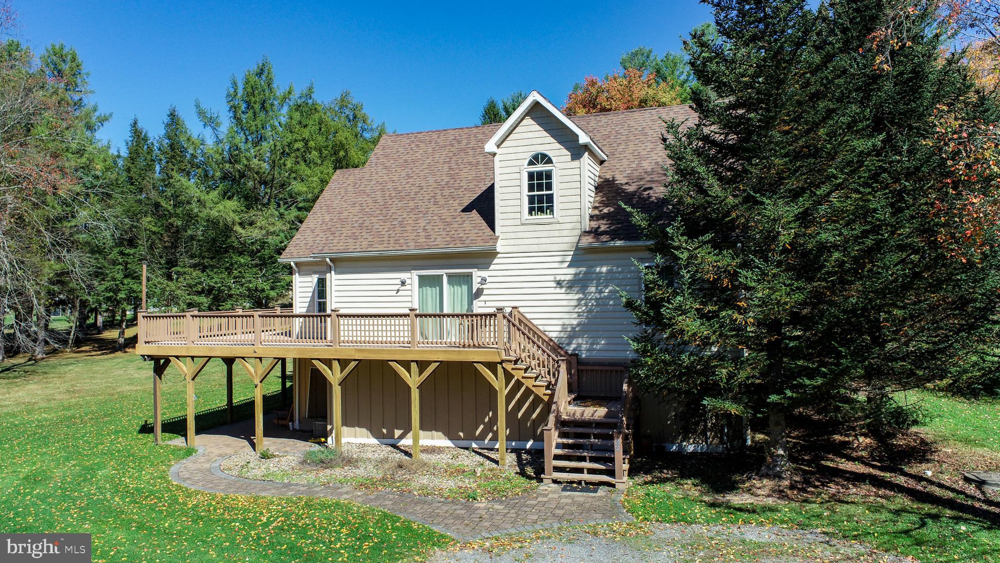 32 Hazelhurst Lane Swanton, MD 21561 - Photo 63 of 73 an aerial view of a house with table and chairs under an umbrella