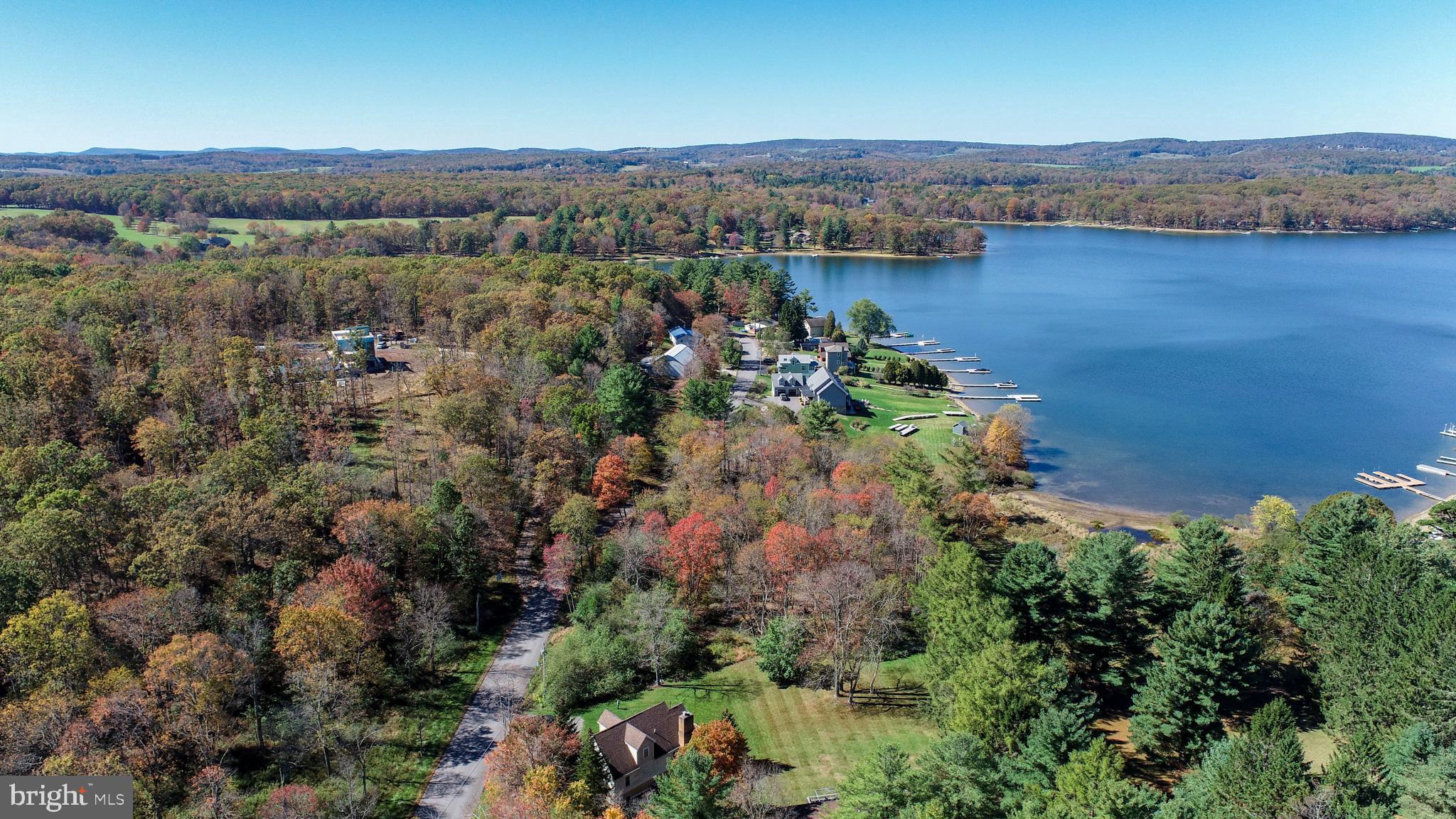 32 Hazelhurst Lane Swanton, MD 21561 - Photo 68 of 73 an aerial view of a houses with a lake