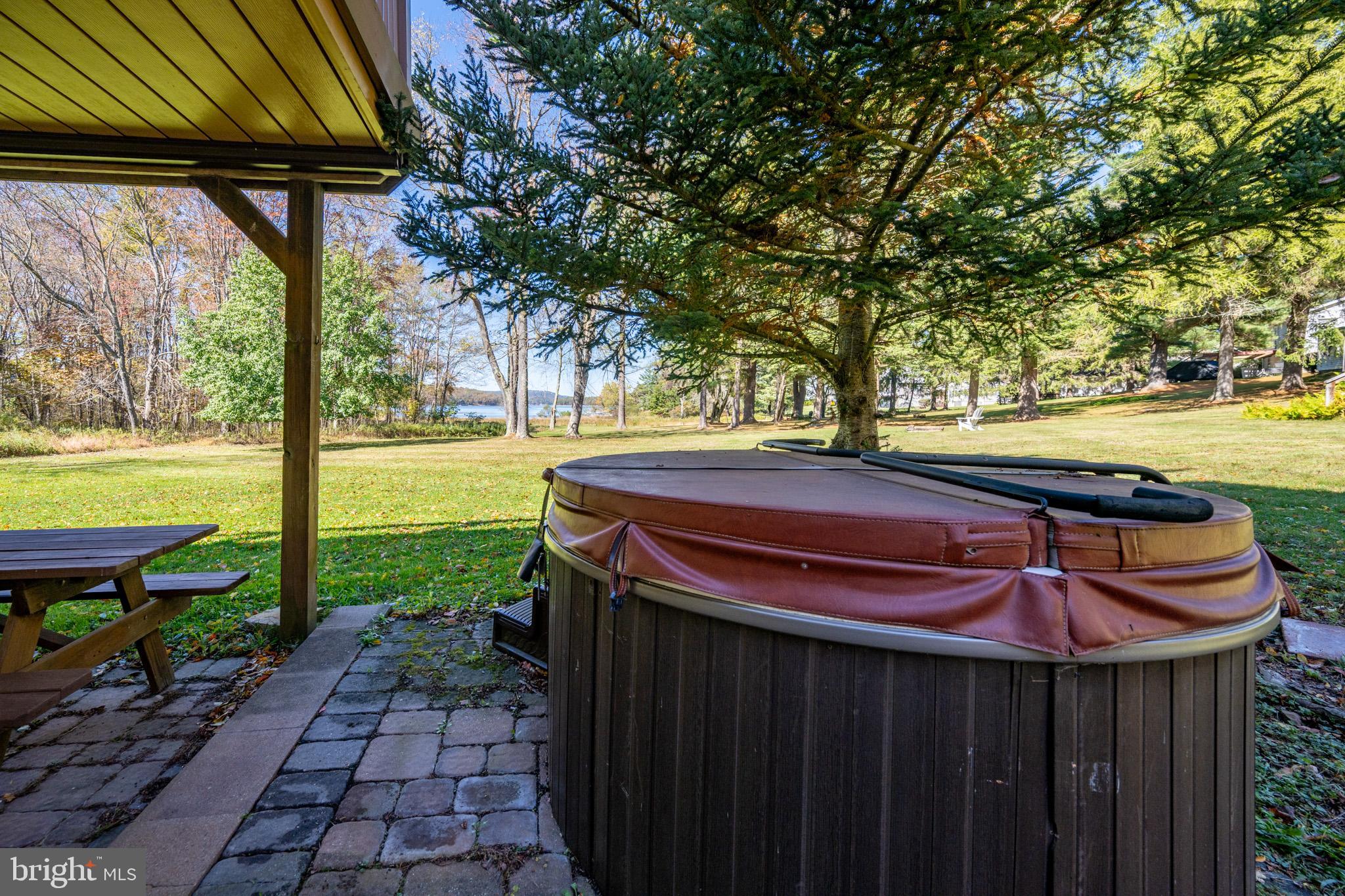 32 Hazelhurst Lane Swanton, MD 21561 - Photo 7 of 73 a view of a backyard with a garden and outdoor seating