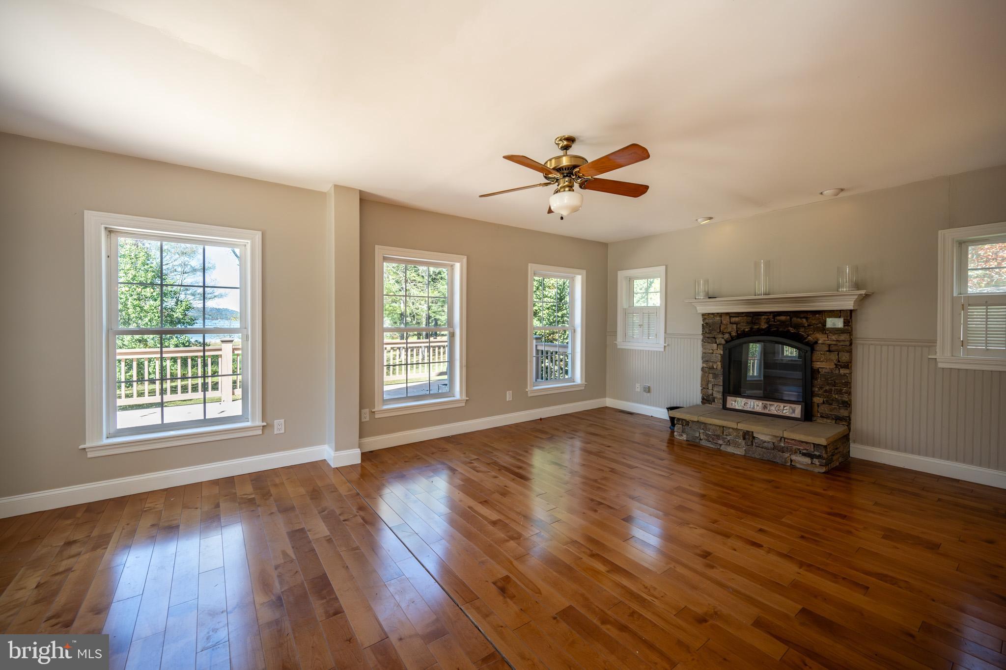 32 Hazelhurst Lane Swanton, MD 21561 - Photo 8 of 73 a view of an empty room with wooden floor and a window