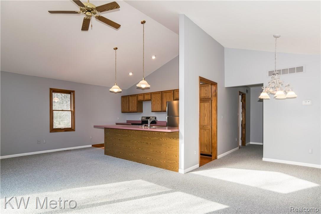 2211 West Wardlow Road Highland, MI 48357 - Photo 32 of 53 In-law suite kitchen/living/dining room.
