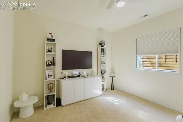 a view of a livingroom with furniture and a flat screen tv