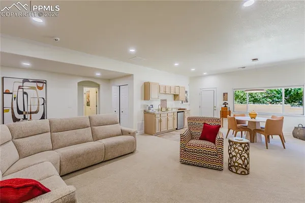 a living room with furniture white walls and white walls