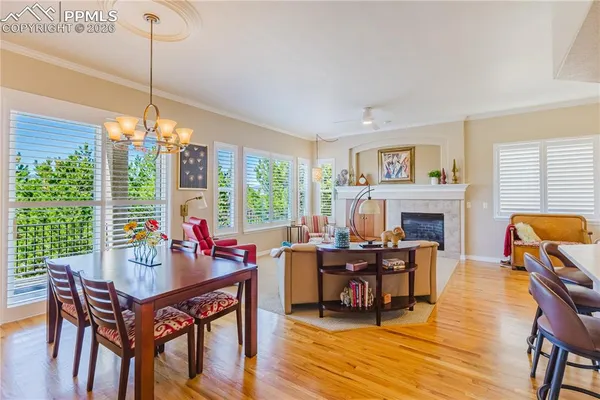 a view of a dining room with furniture window and wooden floor
