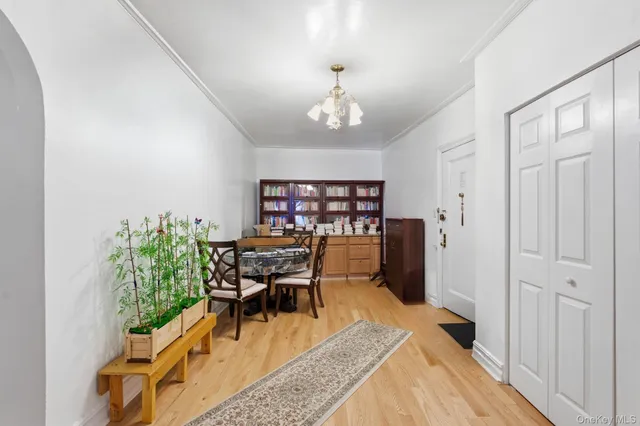 a dining room with furniture a rug and wooden floor