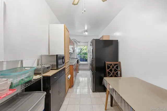 a kitchen with a refrigerator and a stove