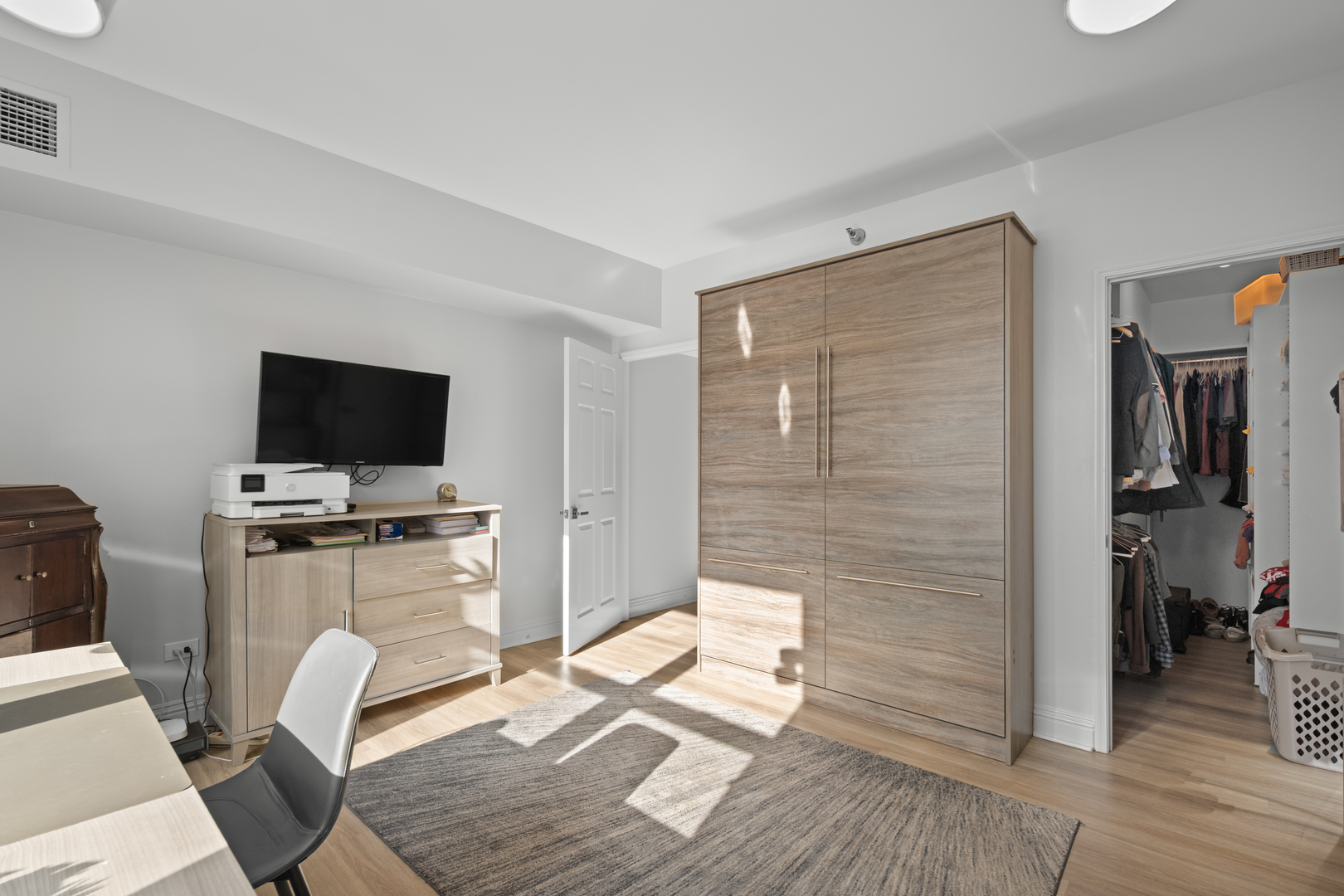 55 West Delaware Place, Unit 614 Chicago, IL 60610 - Photo 14 of 21 a living room with furniture and a flat screen tv