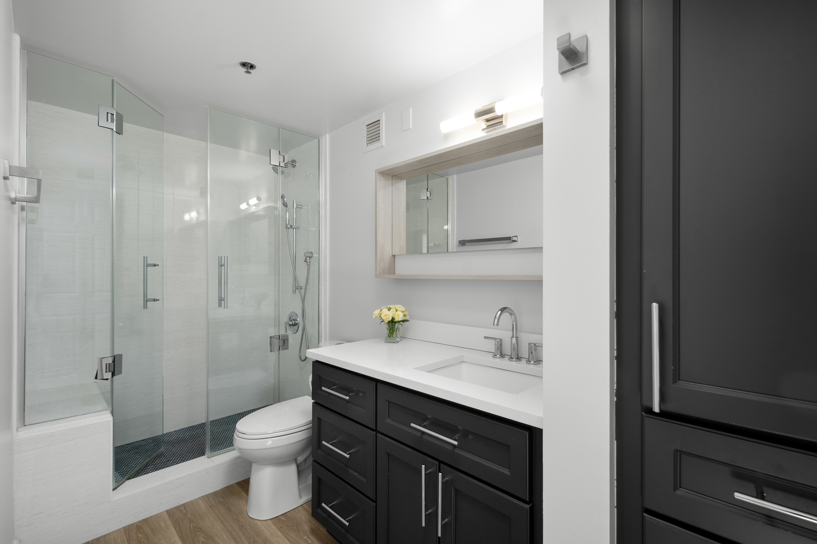 55 West Delaware Place, Unit 614 Chicago, IL 60610 - Photo 15 of 21 a bathroom with a sink a toilet and shower