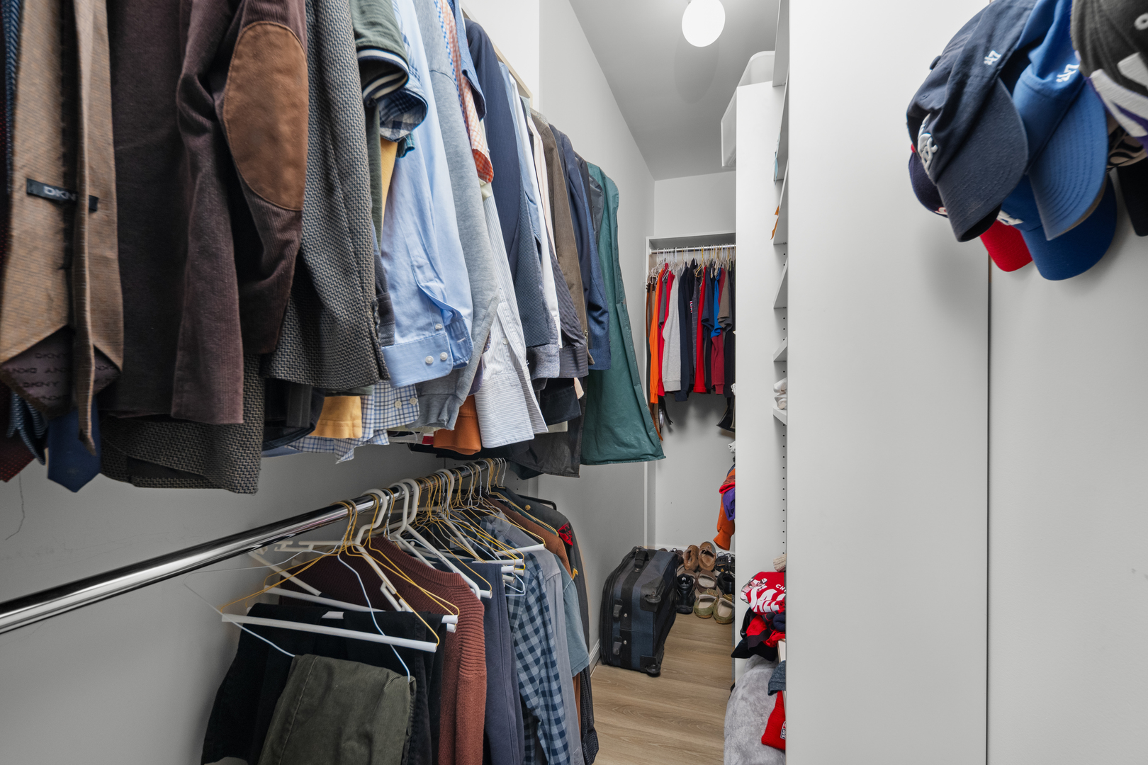 55 West Delaware Place, Unit 614 Chicago, IL 60610 - Photo 17 of 21 a view of walk in closet with clothes and shoes
