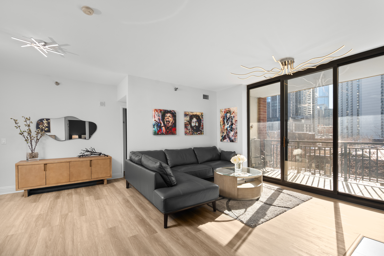 55 West Delaware Place, Unit 614 Chicago, IL 60610 - Photo 4 of 21 a living room with furniture and a large window