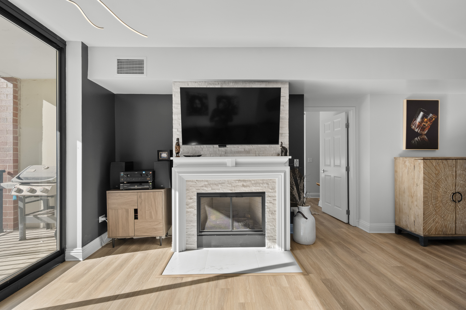 55 West Delaware Place, Unit 614 Chicago, IL 60610 - Photo 5 of 21 a living room with furniture and a flat screen tv