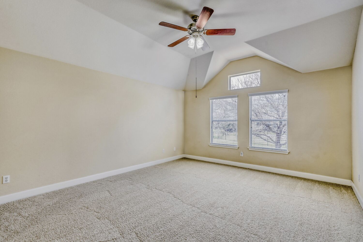 24 Stone Terrace Drive Austin, TX 78734 - Photo 18 of 32 an empty room with a window and a fan