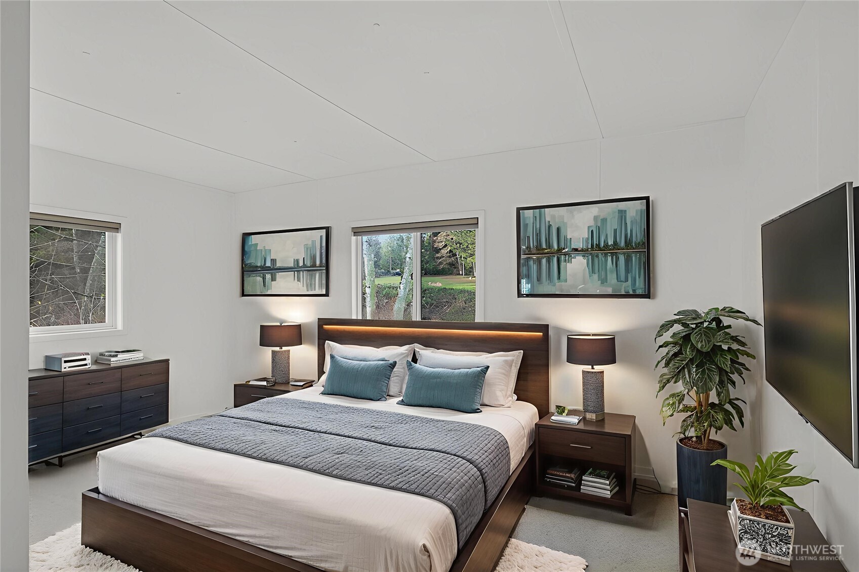 63 North Cross Island Road Camano Island, WA 98282 - Photo 15 of 23 a bedroom with a bed and a potted plant on the dresser