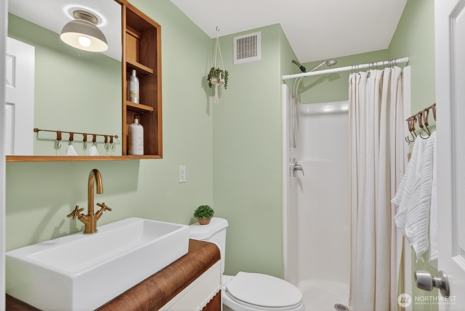 63 North Cross Island Road Camano Island, WA 98282 - Photo 17 of 23 a bathroom with a sink toilet and shower