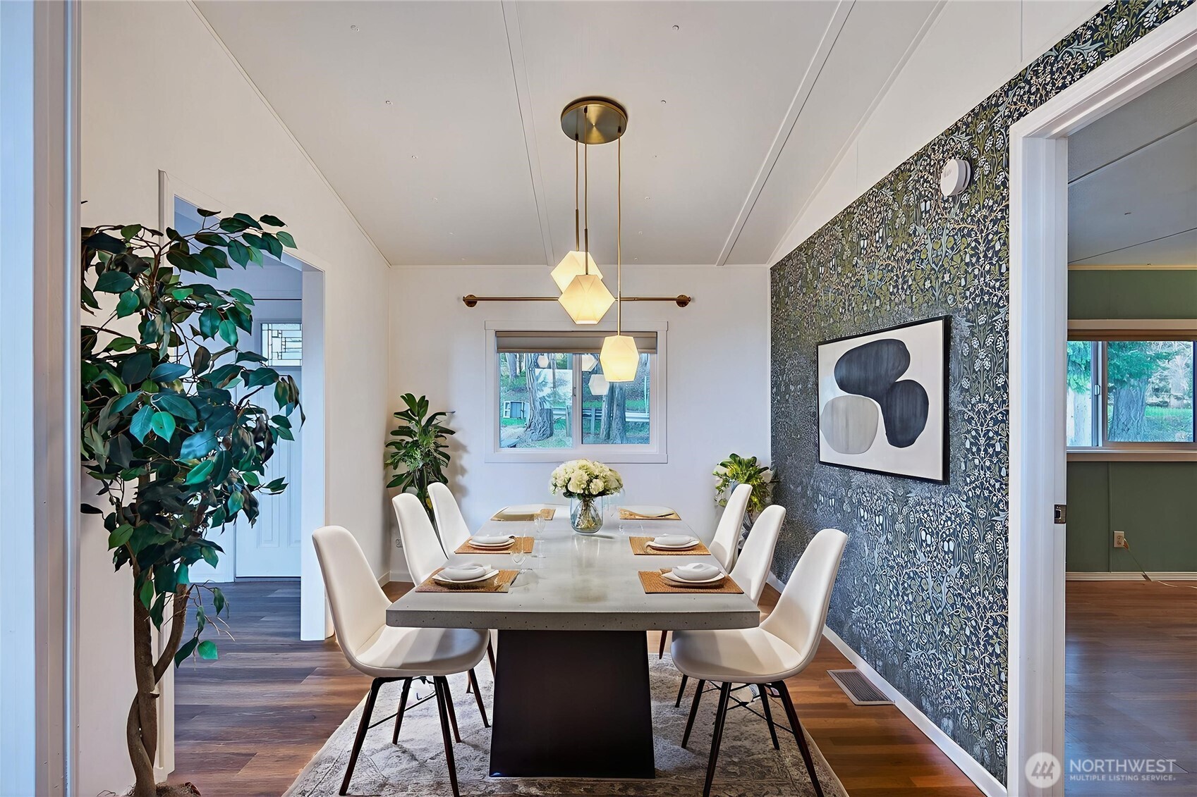 63 North Cross Island Road Camano Island, WA 98282 - Photo 9 of 23 a view of a dining room with furniture window and wooden floor