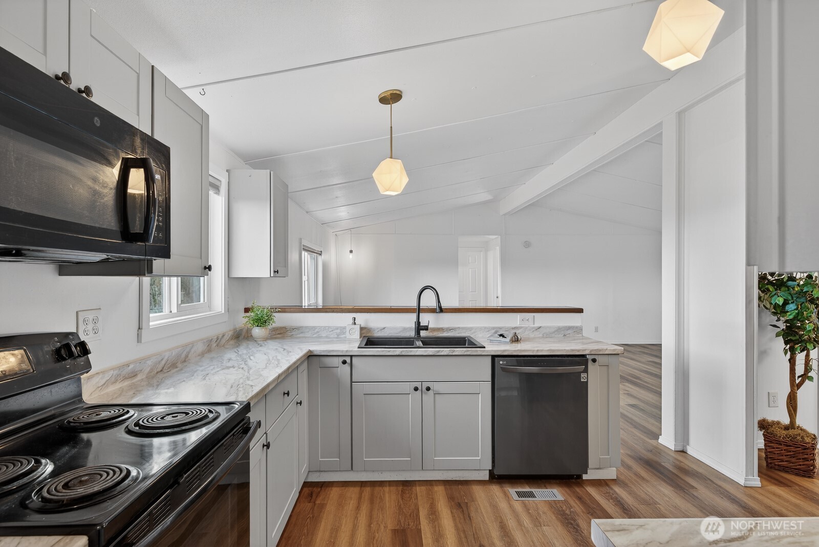 63 North Cross Island Road Camano Island, WA 98282 - Photo 10 of 23 a kitchen with a sink stove and microwave