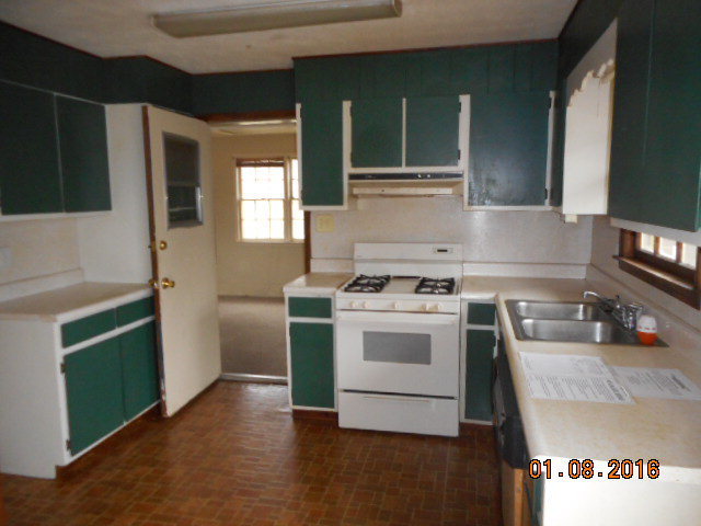 4602 Bishop Road Macon, GA 31206 - Photo 5 of 11 a kitchen with a stove and a sink