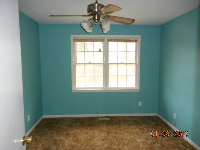 4602 Bishop Road Macon, GA 31206 - Photo 7 of 11 an empty room with windows and fan