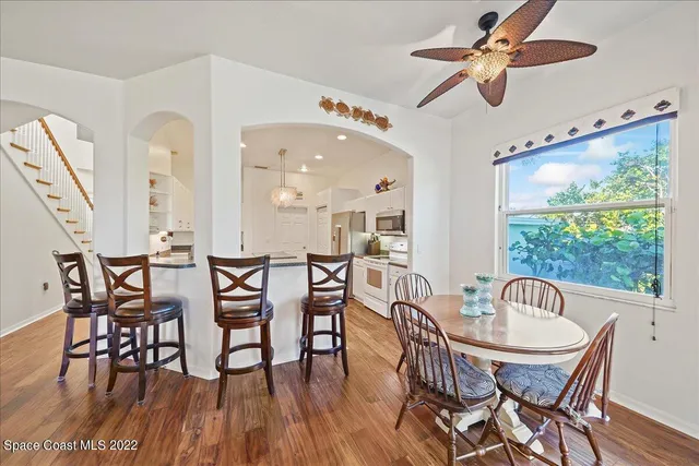 a large kitchen with a large counter top appliances and cabinets