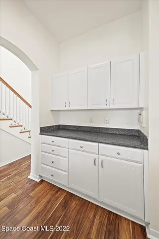 a bathroom with a sink mirror and a shower