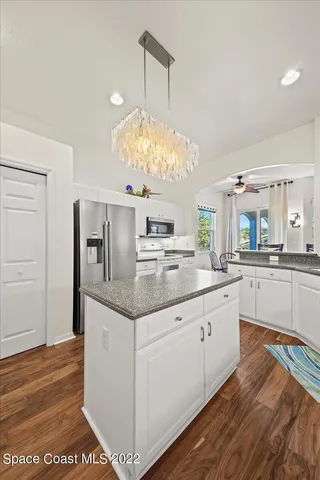 a bathroom with a sink a large mirror and a bathtub