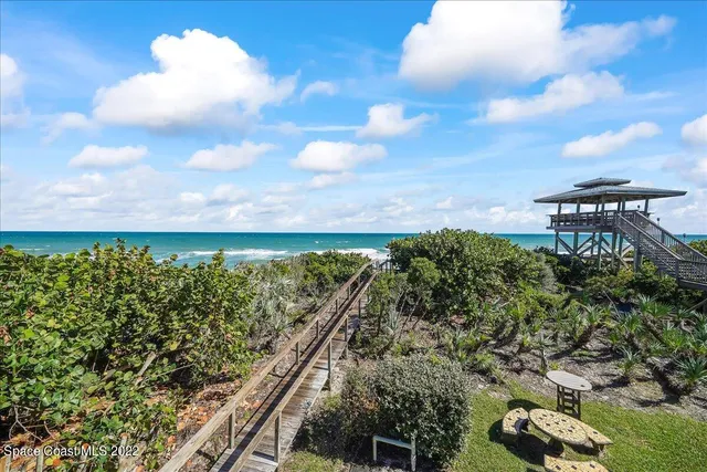 a spacious bathroom with a granite countertop sink a mirror and a