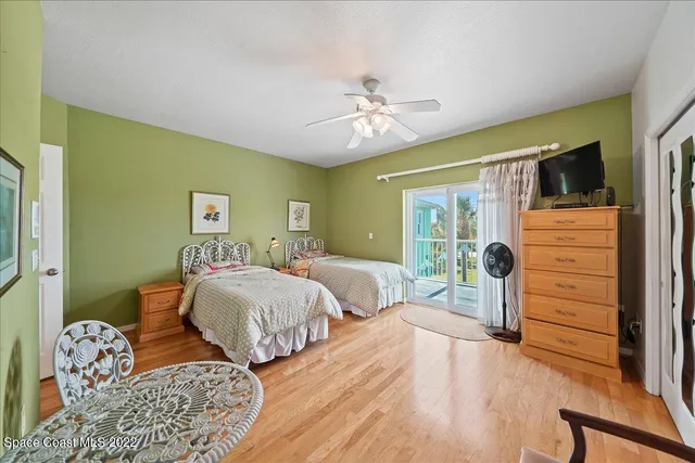 a view of a backyard with plants and a garden