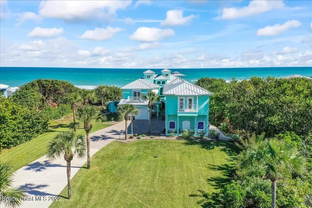 a living room with furniture a window and wooden floor