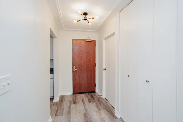 a large room with lots of furniture and a chandelier