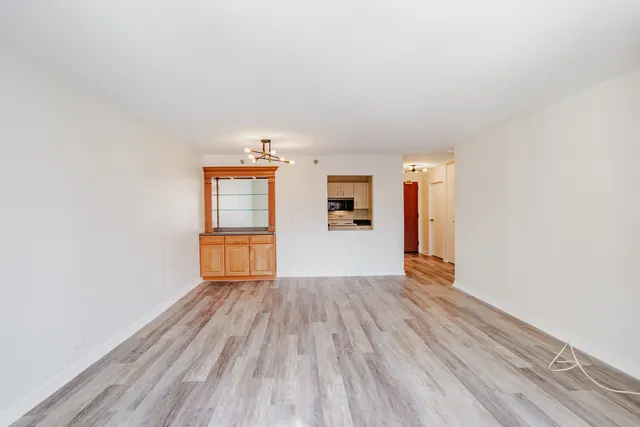 a kitchen with white cabinets stainless steel appliances and sink