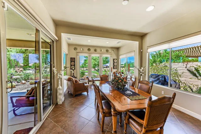 a view of a dining room with furniture window and outside view