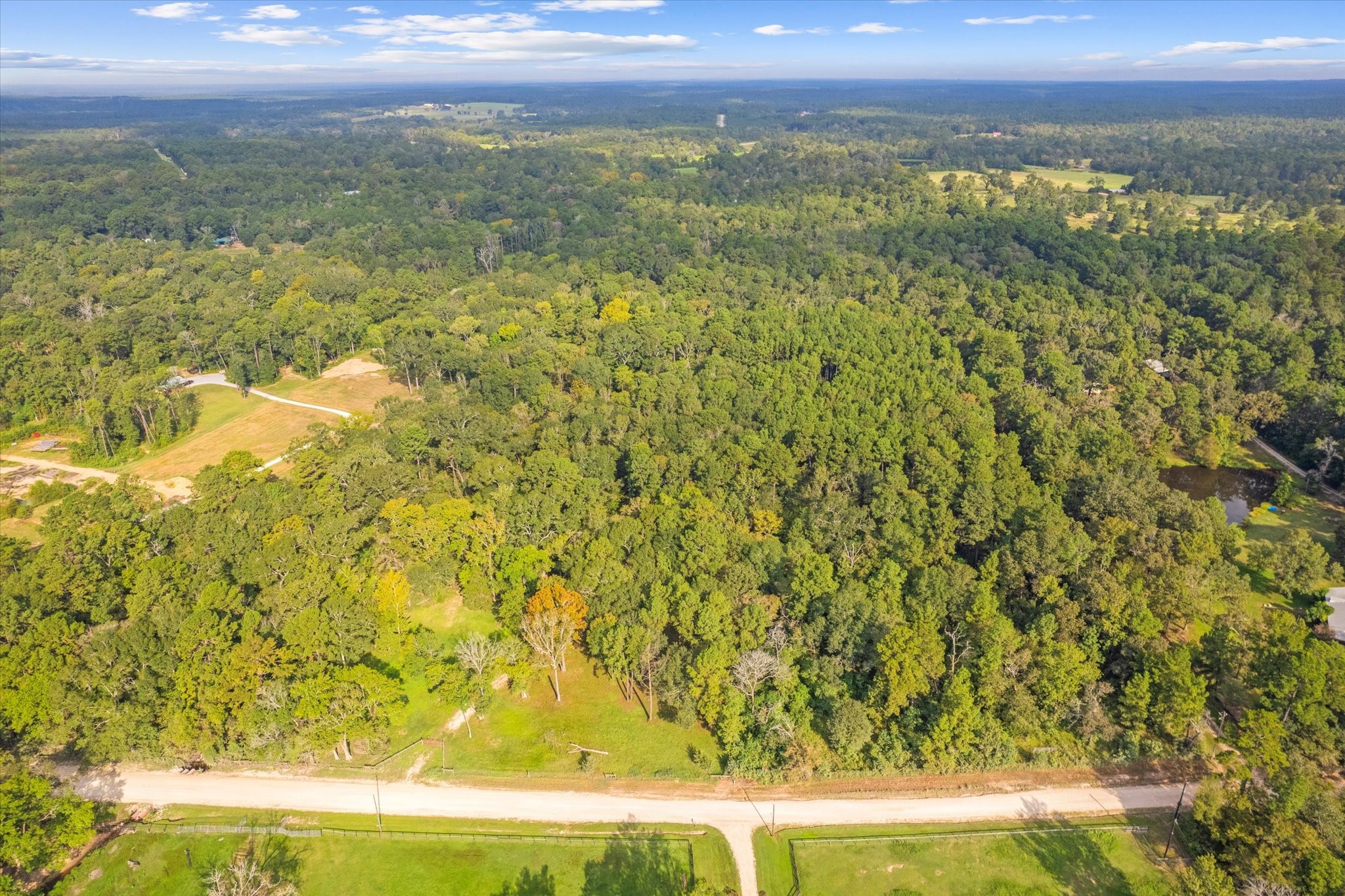 43 Stewart Road New Waverly, TX 77358 - Photo 2 of 21 Ariel view looking from front of property to the back.
