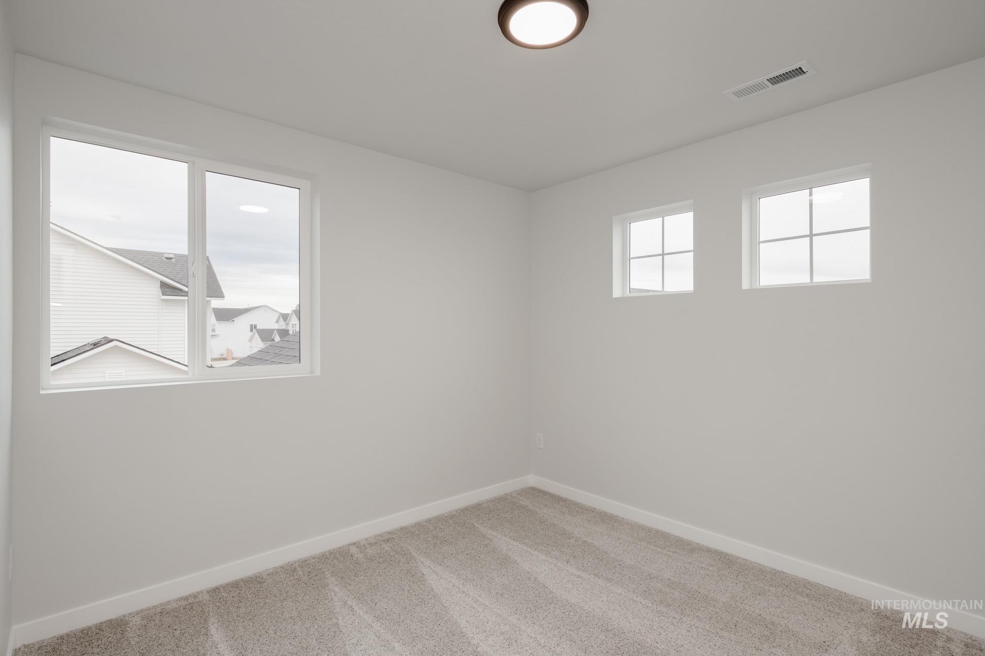 1472 Long Pond Street Middleton, ID 83644 - Photo 19 of 21 Carpeted empty room featuring baseboards