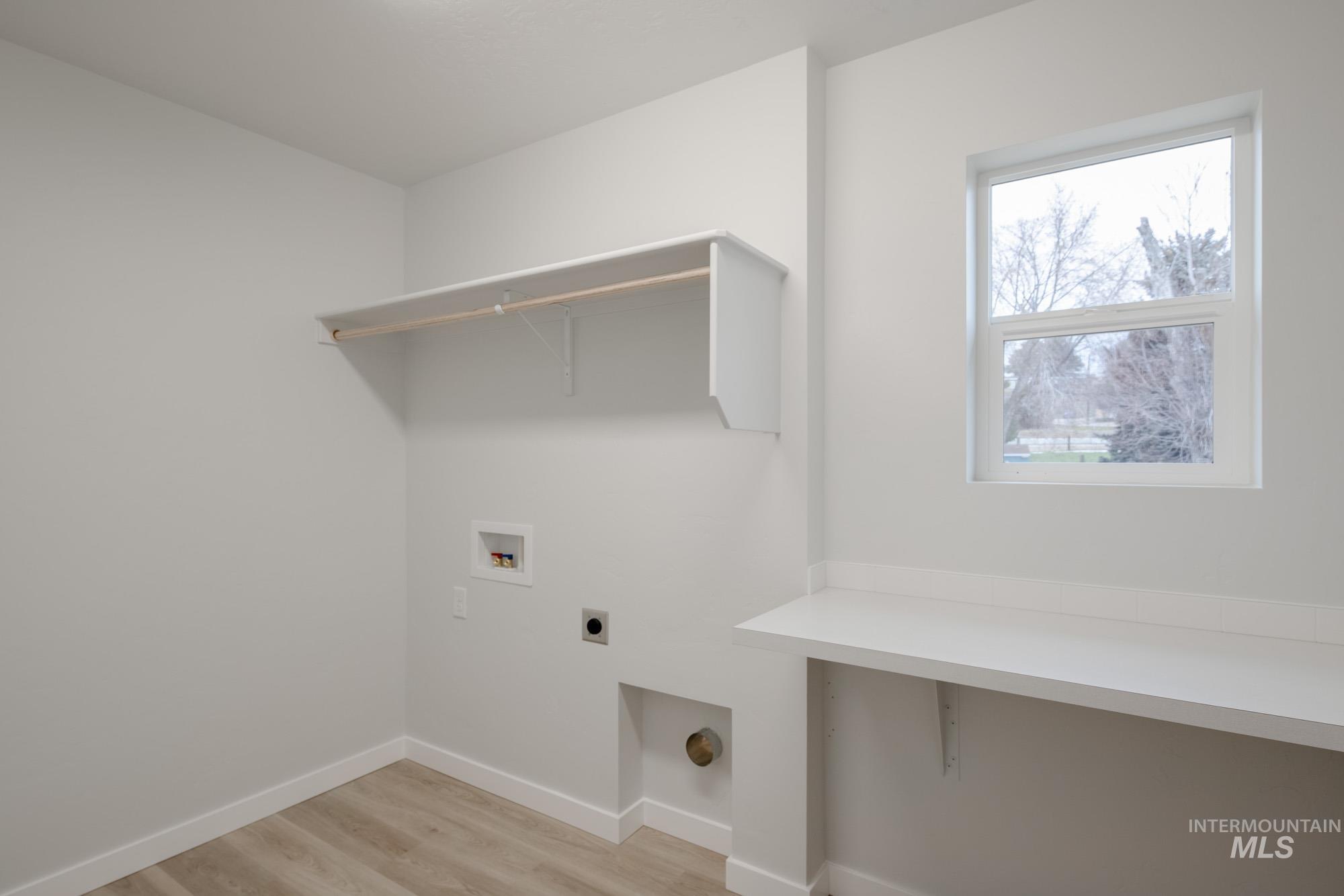 1472 Long Pond Street Middleton, ID 83644 - Photo 21 of 21 Laundry room featuring light wood-type flooring, electric dryer hookup, and hookup for a washing machine