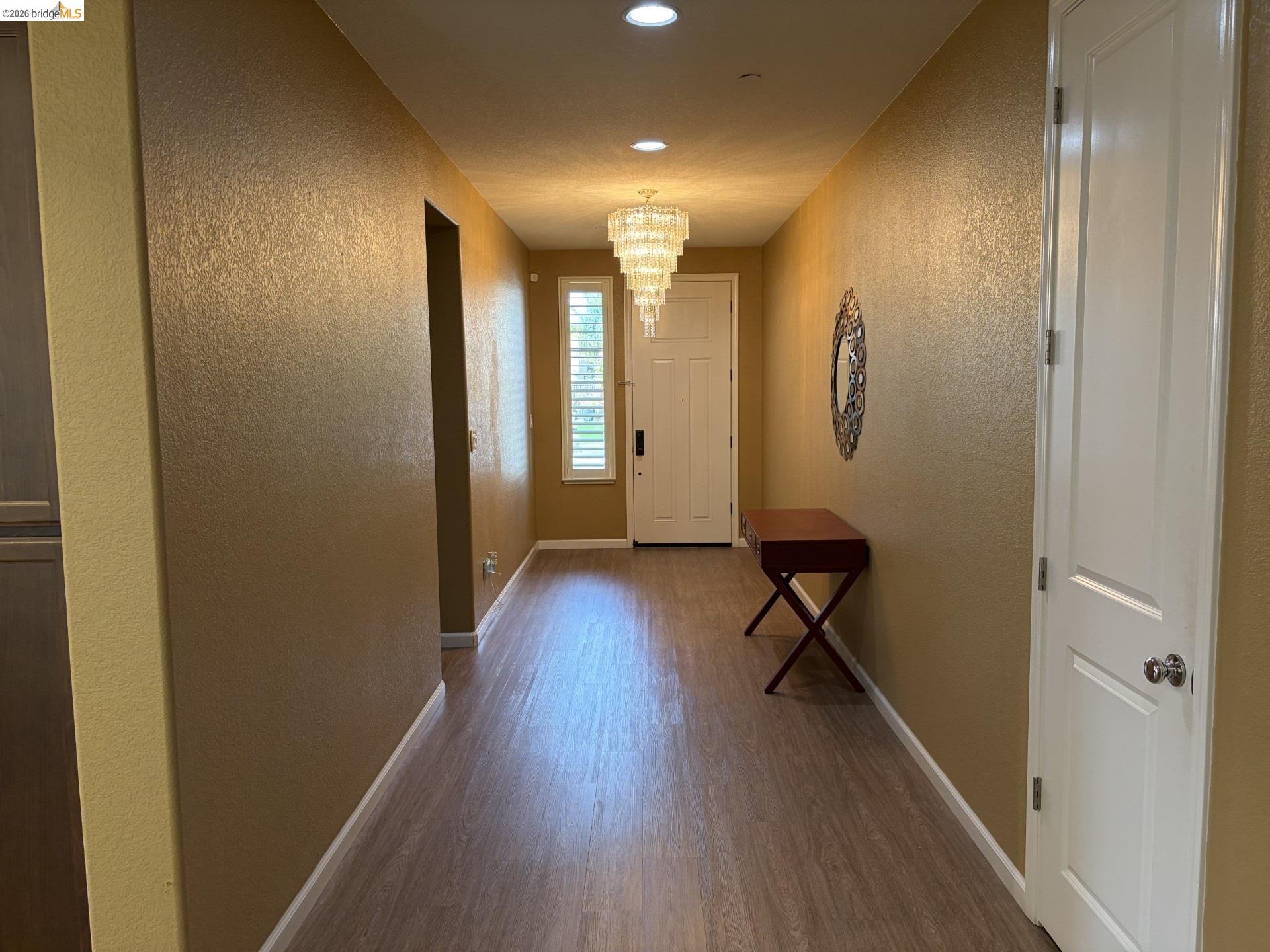 809 Ibis Road Oakley, CA 94561 - Photo 31 of 32 Entryway featuring wood-finish flooring, recessed lighting, and a tiered chandelier