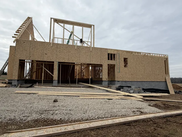 a view of a house with a backyard